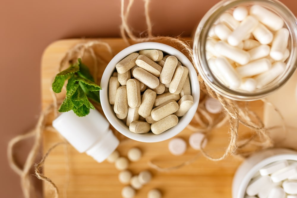 An overhead shot of personalized supplements in a jar. Personalized products represent one of many eCommerce trends in the health & wellness industry.