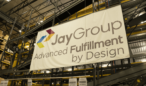 A banner in Jay Group's fulfillment facility that reads: "Jay Group. Advanced Fulfillment by Design."
